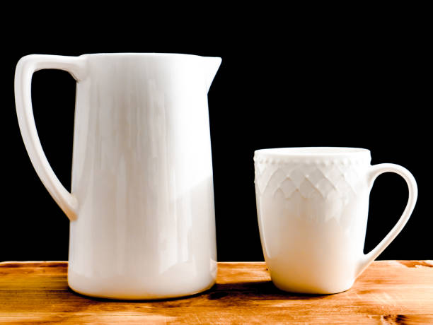 istock A white porcelain glass and jug. 1971073046