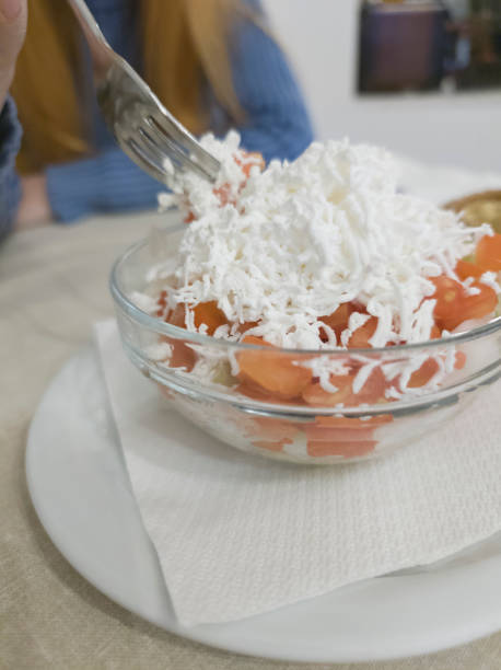 Mixed tomato and cheese salad in bowl