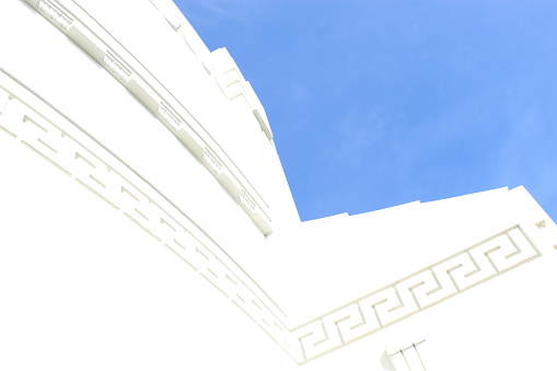 Angle where the white building corners meet the blue sky