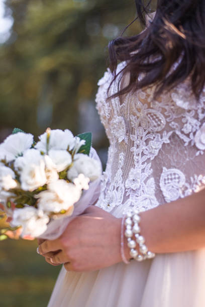 Bride holding a white floral bouquet
