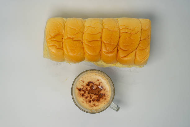 Bread and a glass of cappuccino coffee