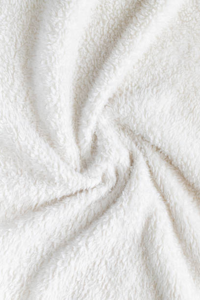 istock White soft plush fabric of cozy plush throw. Cozy blanket. 1971308188