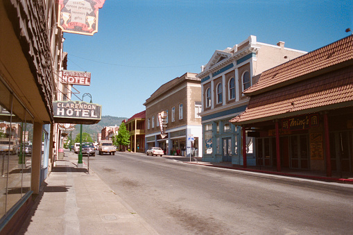 Yreka, California, USA - May 19, 1992:  Grainy film photograph of the Clarendon Hotel sign and East Miner street in historic downtown Yreka.