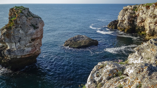 High inaccessible coastal cliffs made of shell rock near the village of Tyulenovo, southern Bulgaria