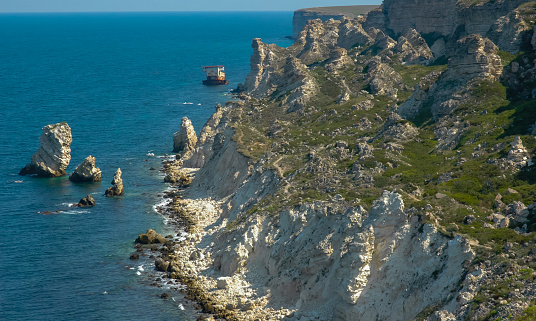 View of the steep banks and rocks in the water in the Dzhangul tract, western Crimea