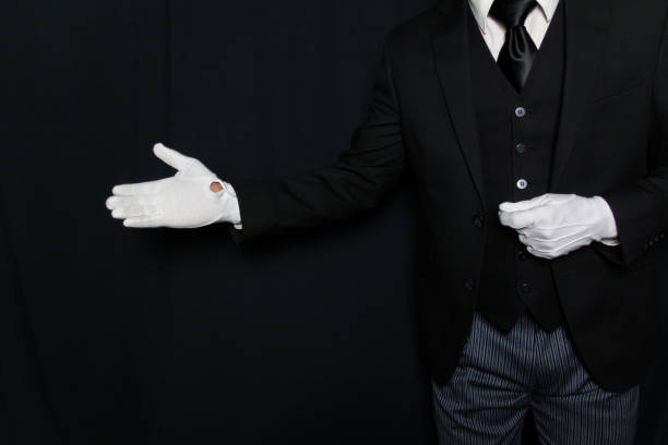 istock Butler With Welcoming Gesture 1971355714