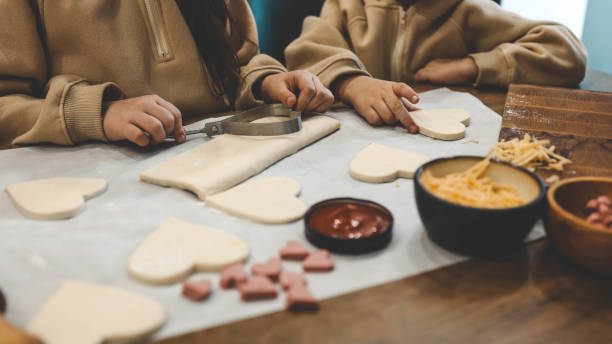 istock Children making pizza in the kitchen 1971362653