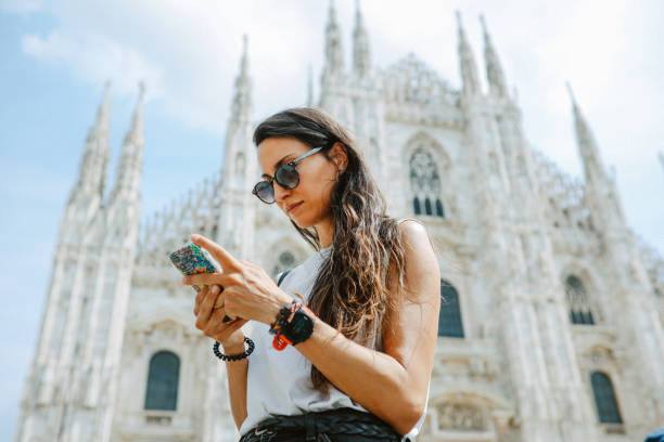 checking maps on smartphone in Milan, Italy