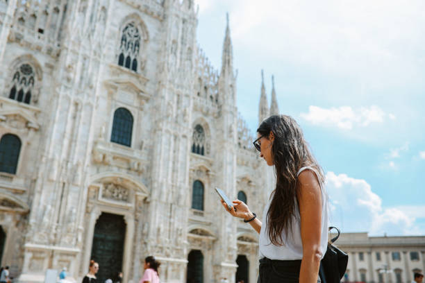 istock checking maps on smartphone in Milan, Italy 1971417552