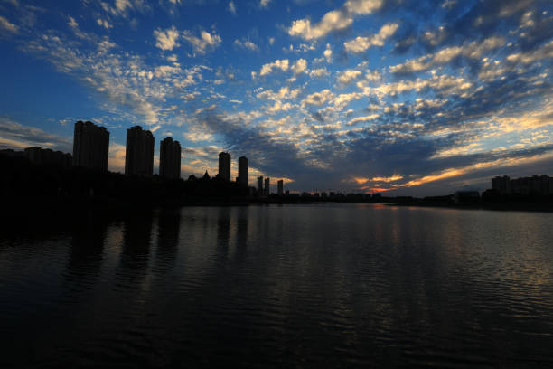 istock Evening scenery of waterfront city, North China 1971427009