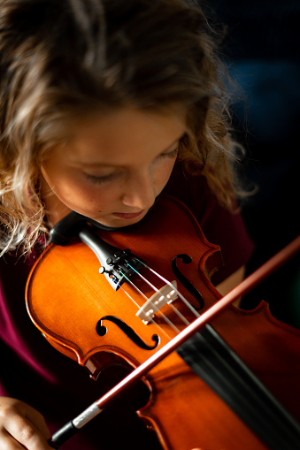 Young girl playing the violin