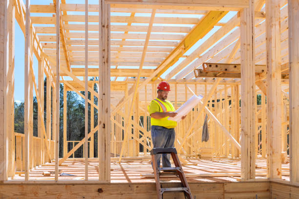 istock To verify quality of work being performed, safety inspector used blueprint construction projects during 1971476268