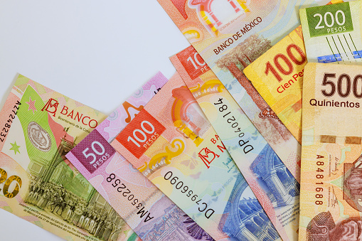 Different Mexican money denominations such as 500, 200, 50, 20 peso notes bills