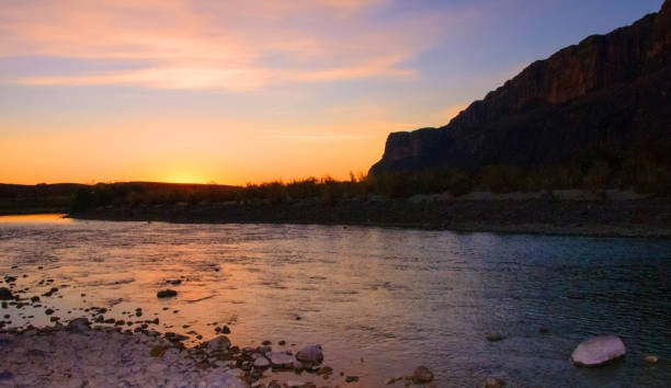 Red sunset over the Rio Grande River flowing from Mexico