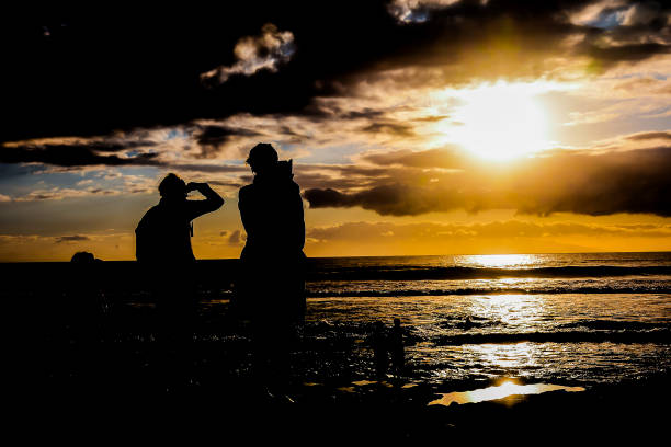 istock Surfer at sunset on a calm ocean 1971504140