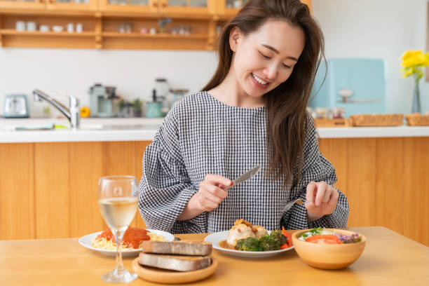 istock asian woman who eats 1971511775