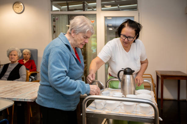 istock Senior women getting her first morning coffee in a nursing home 1971533585