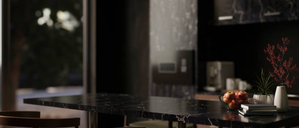 istock Close-up image of a modern black marble dining table in a modern black kitchen. 1971555965