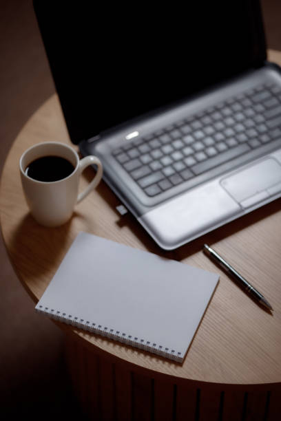 Writer's high: laptop, blank page and aromatic coffee.