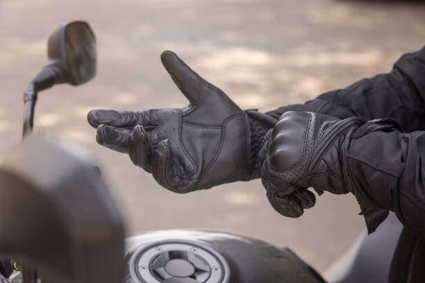 istock Indian biker puts on his helmet before getting on his motorbike 1971721836