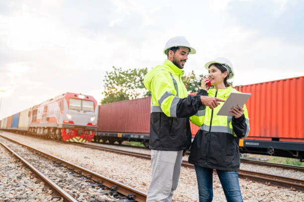 istock Team of engineer railway wearing safety uniform and helmet under checking train ,wheels and control system for safety transportation. Maintenance cycle concept. 1971775957