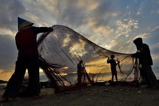 Gampong Jawa - Banda Aceh, Aceh - Indonesia. Jan 28, 2019\n\nThe trawling tradition of the coastal communities of the city of Banda Aceh in Gampong Jawa which they do every afternoon as a means of livelihood to meet their family's needs.