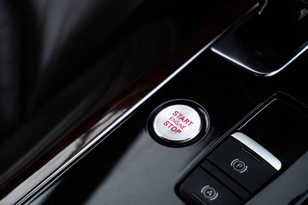 istock Start engine stop button Interior of modern luxury car. Details of automatic transmission gear shift, multimedia control system, car control panel, Air Vent Red emergency button and dashboard inside. Prestige sport automobile 1971778706