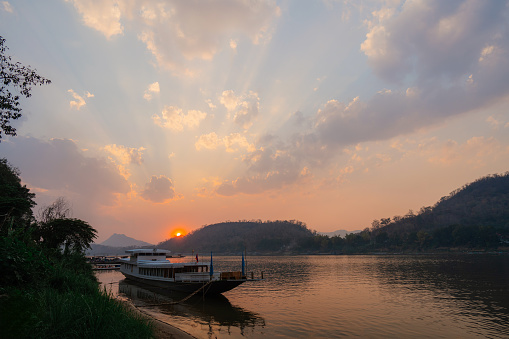Scenic view of boats on Mekong River at sunset