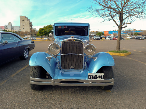 Buenos Aires, Argentina - Jun 04, 2023: Old blue early 1930s Dodge Brothers Six two door sedan custom street rod in a parking lot at a classic car show. Front view