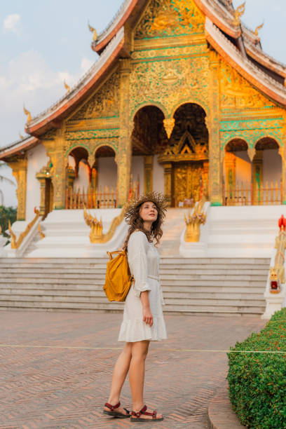 istock Woman exploring buddhist temple in Laos 1971792941