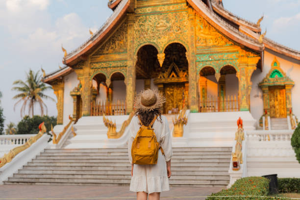 istock Woman exploring buddhist temple in Laos 1971792942