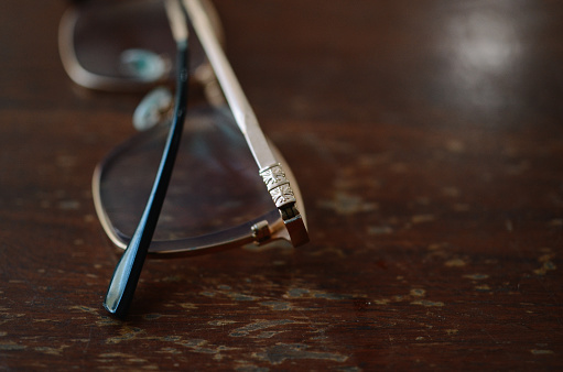 Eyeglasses on green background.