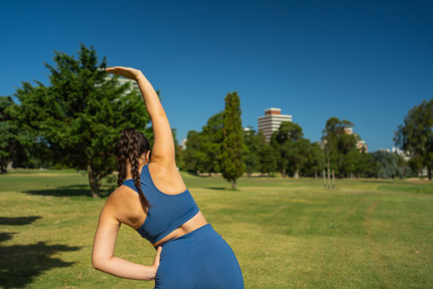 istock A woman stretching her back after a workout. Outdoor exercise. 1971811962