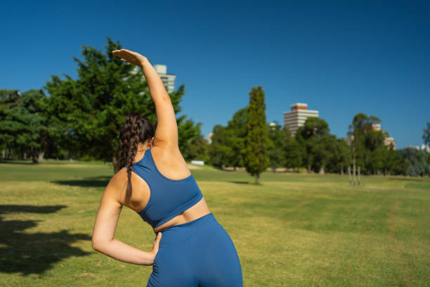 istock A woman stretching her back after a workout. Outdoor exercise. 1971811963