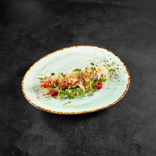 istock Salad with avocado, crab, and quinoa on a speckled turquoise plate 1971823611