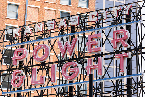 Kansas City, Missouri, USA - June 15, 2023:  Afternoon light shines on the historic Power and Light district neon sign.