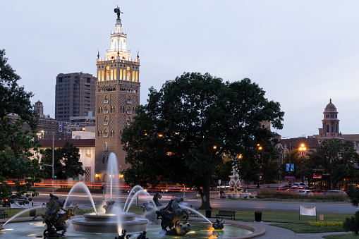 Kansas City, Missouri, USA - June 15, 2023: Night time traffic passes through the historic Plaza district.