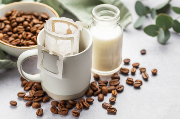istock Drip coffee bag with ground coffee in  cup 1971836128