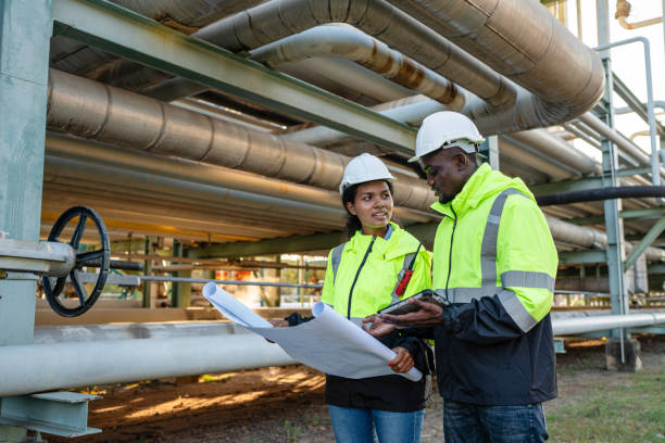 istock Engineer holding blueprint drawing to checking and inspection gas pipeline system. 1971848036