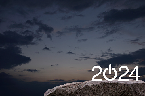 2024 start up business flat icon on rock mountain over sunset sky, Happy new year 2024 success concept