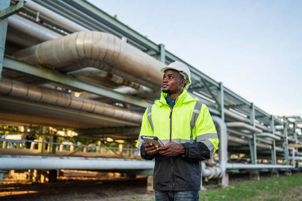 istock Mechanical engineer working and holding tablet to checking and inspection gas pipeline system. 1971865509
