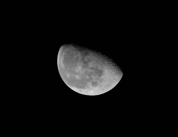 istock half waxing gibbous moon on night sky 1971871676