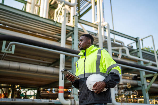 istock Mechanical engineer working and holding tablet to checking and inspection gas pipeline system. 1971883075