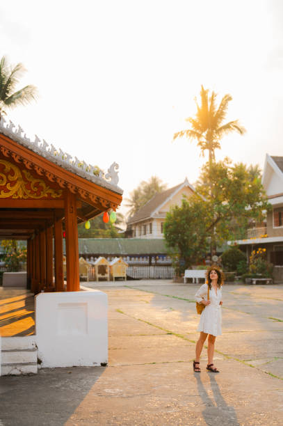 istock Woman exploring buddhist temple in Laos 1971887598