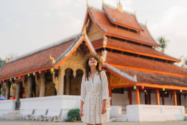 istock Woman exploring buddhist temple in Laos 1971887600