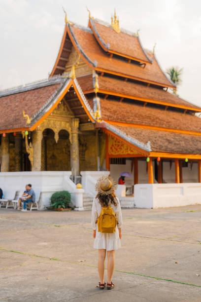 istock Woman exploring buddhist temple in Laos 1971887601