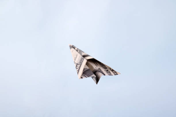 istock Paper airplane from the dollars 1971929608