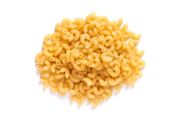 istock Pile of pasta cones on a white background. 1971946902