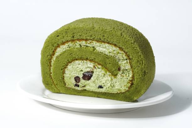 istock a small piece of green cake on a plate with chocolate chips 1971947011