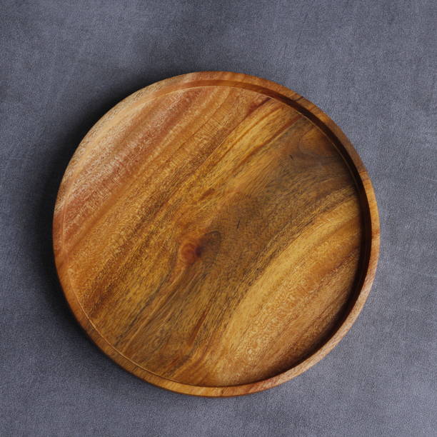 istock a handmade wooden plate, with a beautiful texture 1971954365